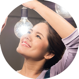 A ypung woman upgrades her lighting in a residentiasl home