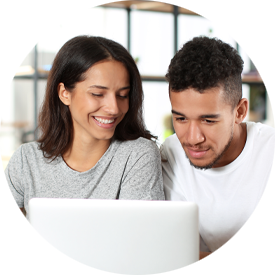 Young couple with laptop at home